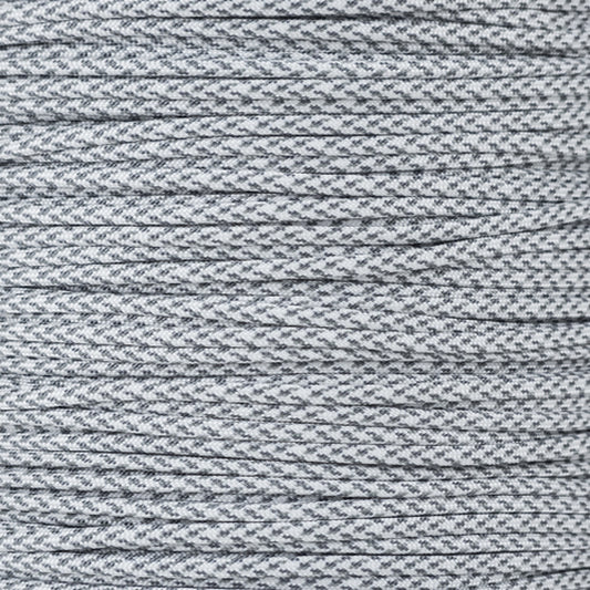 a spool of gray thread on a white background