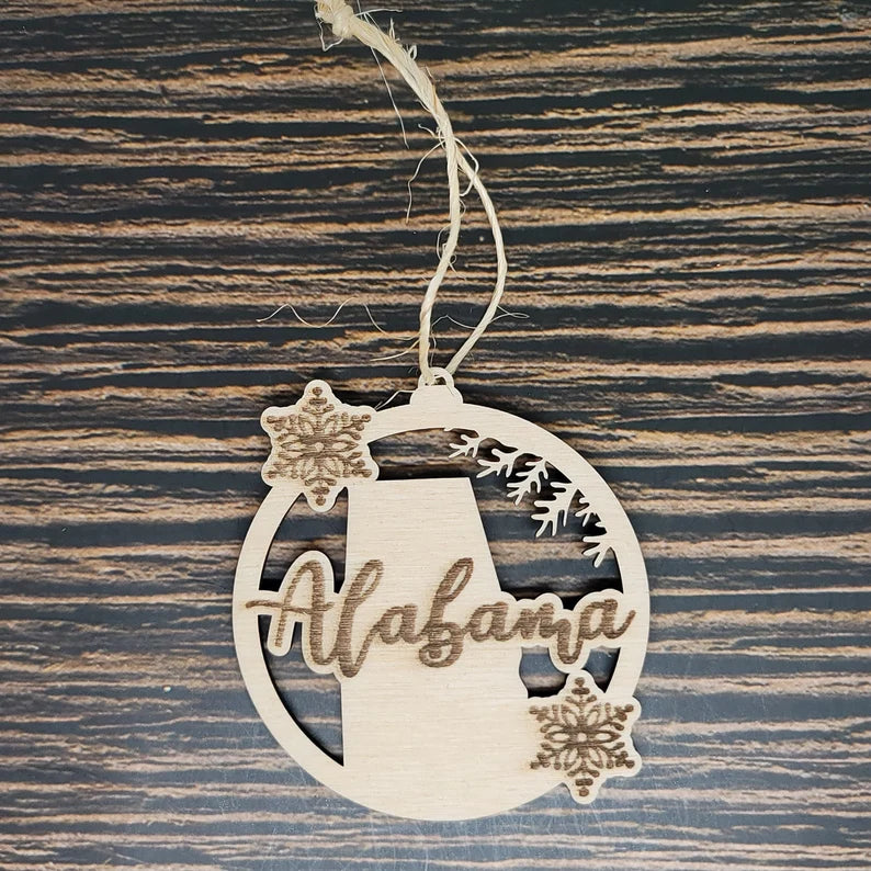 a wooden ornament with the state of Alabama on it