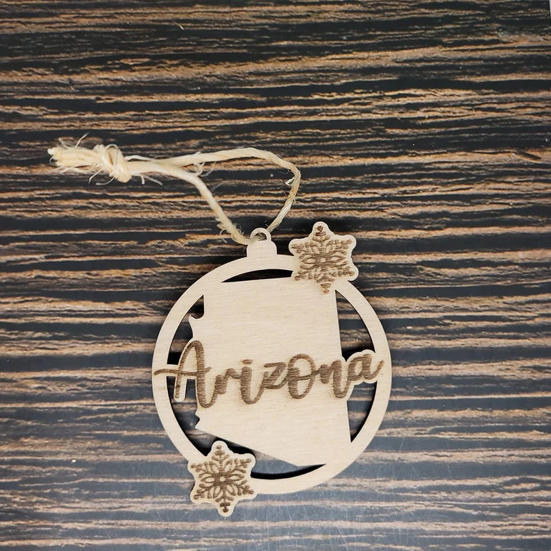 a wooden ornament with the word arizona on it