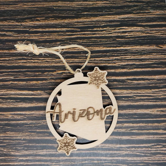 a wooden ornament with the word arizona on it