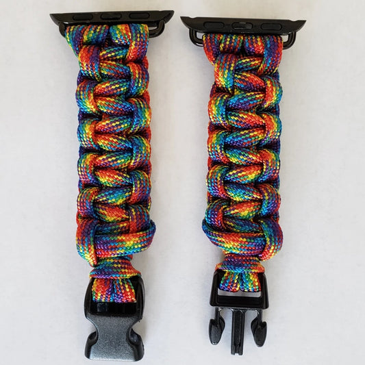 a pair of black clips holding a multicolored paracorage