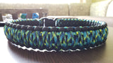 a close up of a blue and green and black collar