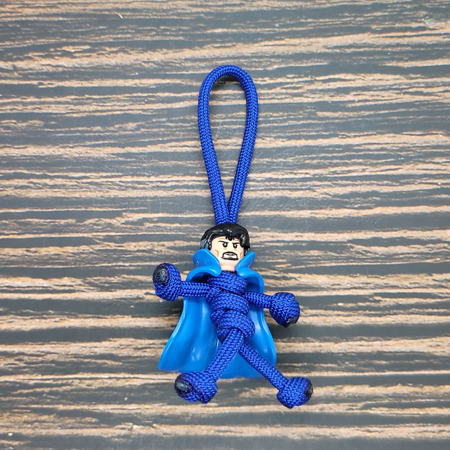 a blue key chain with a monkey on it