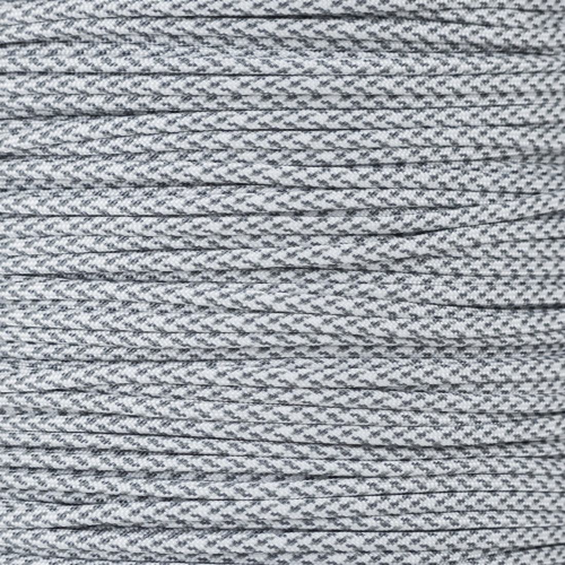 a spool of gray thread on a white background