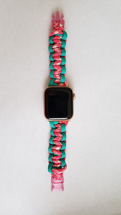 an apple watch with a pink and turquoise band