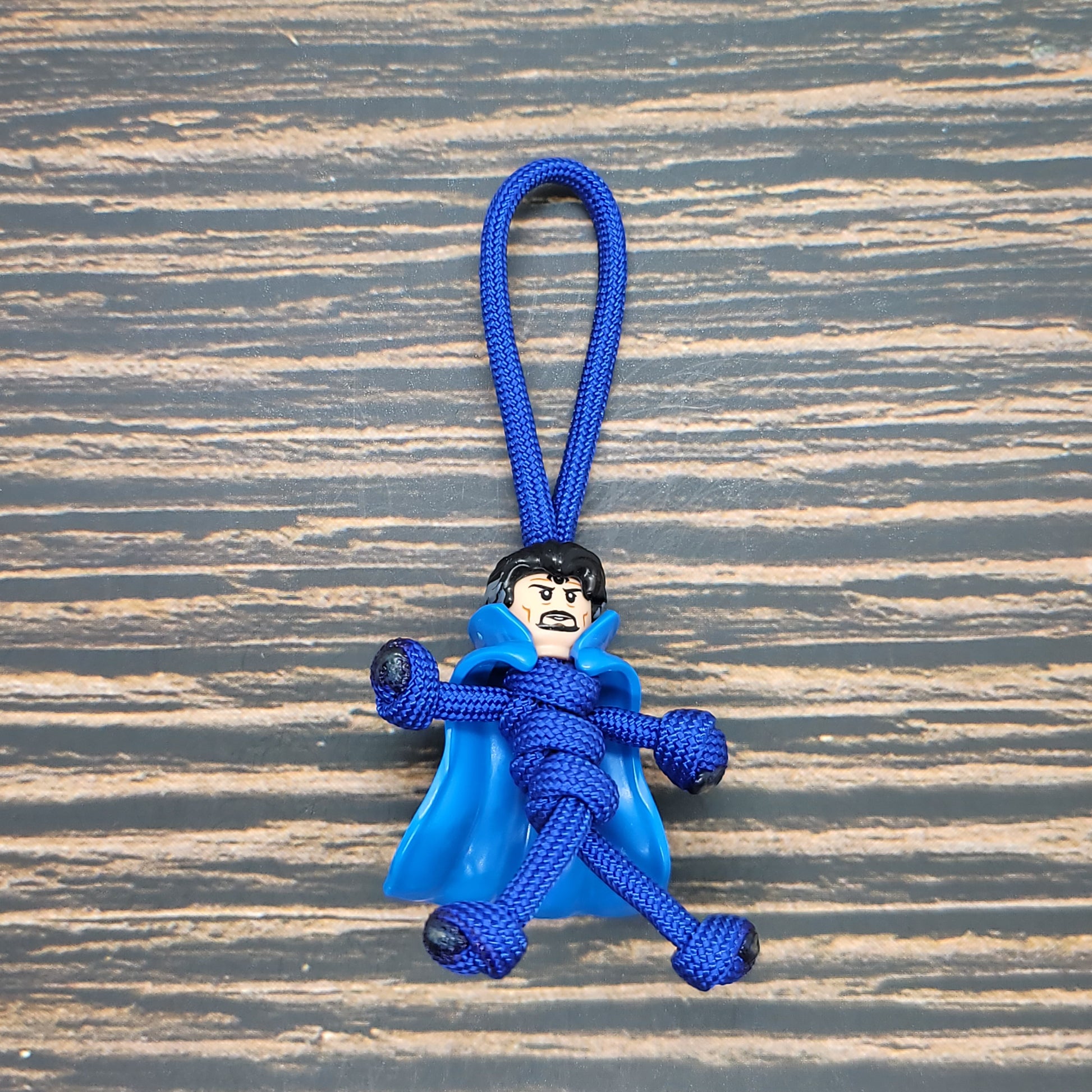 a blue key chain with a monkey on it