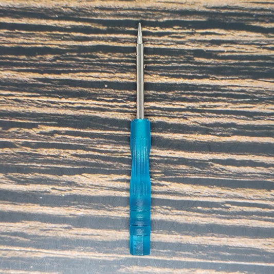 a blue pen sitting on top of a wooden table