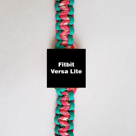 An Insanely Paracord Fitbit Versa Lite Paracord Watch Band - Durable, Stylish, and Water-Resistant with a screen displaying the text "Fitbit Versa Lite." The watch is attached to a high-quality paracord band featuring a pattern with turquoise, pink, and white colors on a white background. This stylish smartwatch accessory blends function and flair seamlessly.